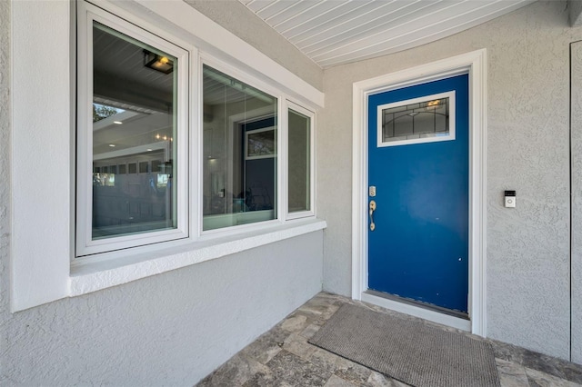 1620 Sea Breeze Dr, Tarpon Springs, FL 34689 - property entrance featuring stucco siding