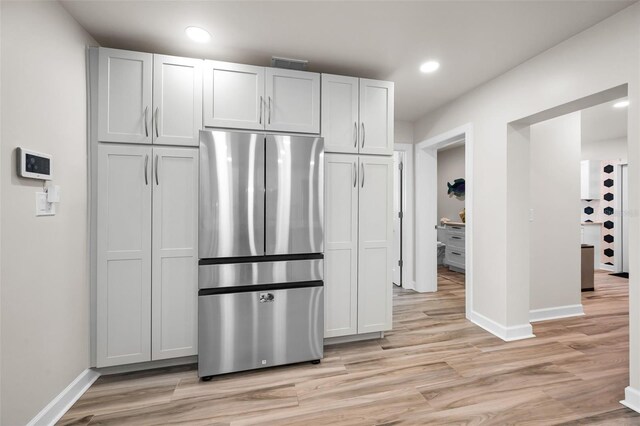 1620 Sea Breeze Dr, Tarpon Springs, FL 34689 - kitchen with freestanding refrigerator, baseboards, light wood-style floors, and recessed lighting