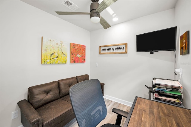 1620 Sea Breeze Dr, Tarpon Springs, FL 34689 - office space featuring wood finished floors, a ceiling fan, and baseboards