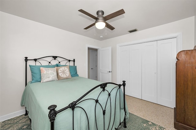 1620 Sea Breeze Dr, Tarpon Springs, FL 34689 - bedroom featuring speckle patterned floor, a closet, a ceiling fan, and baseboards