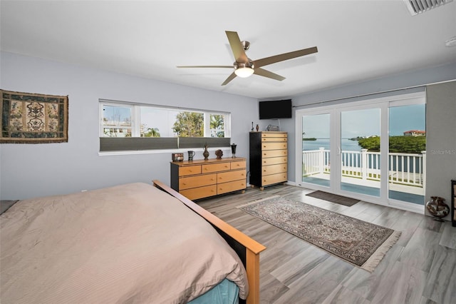 1620 Sea Breeze Dr, Tarpon Springs, FL 34689 - bedroom with access to outside, wood finished floors, and ceiling fan