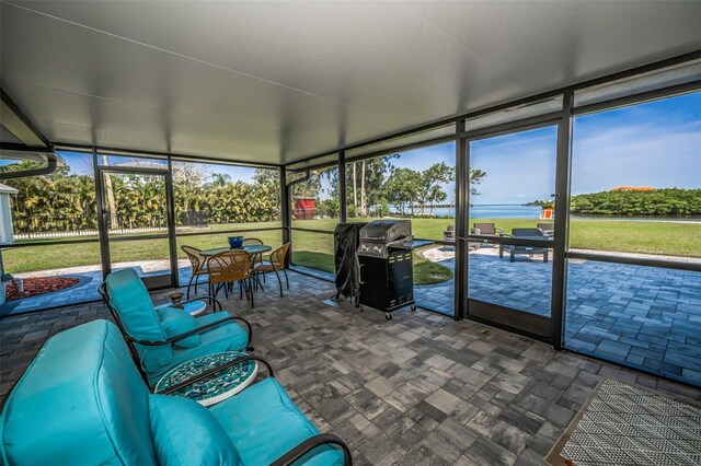 1620 Sea Breeze Dr, Tarpon Springs, FL 34689 - sunroom with outdoor dining area