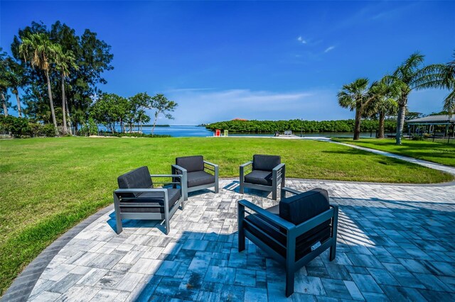 1620 Sea Breeze Dr, Tarpon Springs, FL 34689 - view of patio featuring a water view and outdoor lounge area