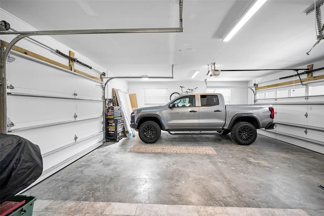 1620 Sea Breeze Dr, Tarpon Springs, FL 34689 - garage featuring a garage door opener