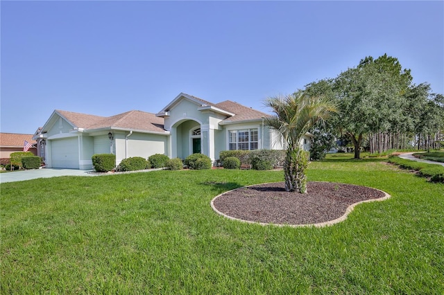 view of front of home featuring a garage, stucco siding, concrete driveway, and a front lawn