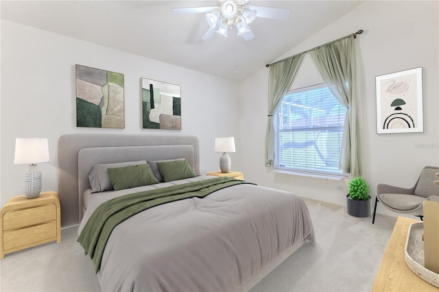 bedroom featuring carpet, lofted ceiling, and ceiling fan