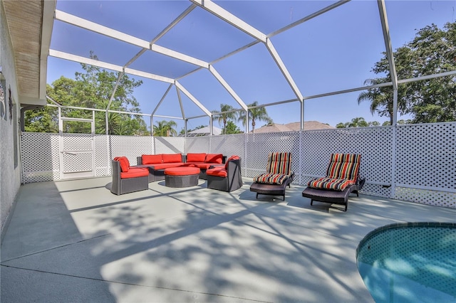 view of patio / terrace with an outdoor hangout area and glass enclosure