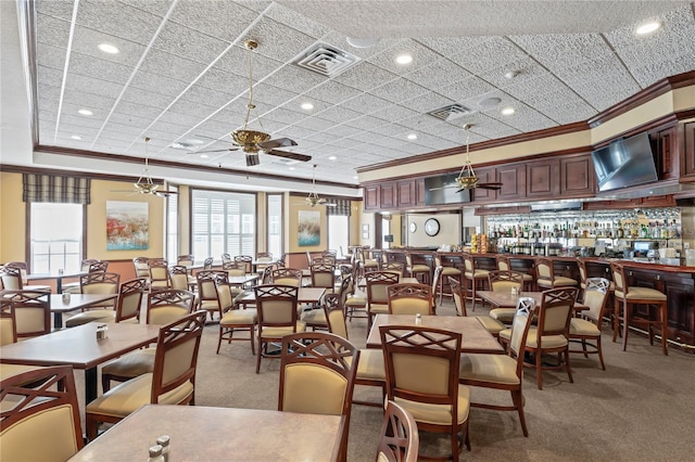 dining room with ornamental molding, light carpet, ceiling fan, and recessed lighting
