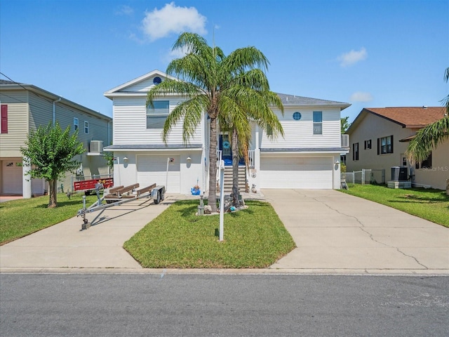 4292 Tahiti Dr, Hernando Beach, FL 34607 - view of front of house with a garage, a front lawn, concrete driveway, and cooling unit