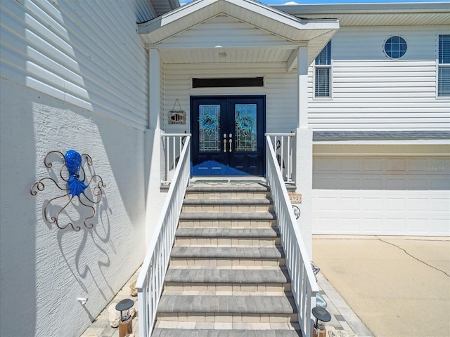 4292 Tahiti Dr, Hernando Beach, FL 34607 - doorway to property with french doors, a garage, and concrete driveway