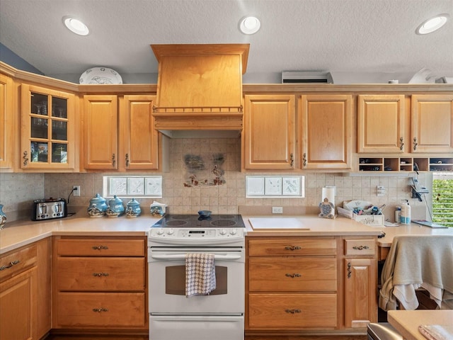 4292 Tahiti Dr, Hernando Beach, FL 34607 - kitchen featuring electric stove, light countertops, a textured ceiling, glass insert cabinets, and decorative backsplash