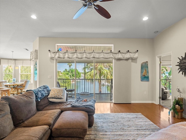 4292 Tahiti Dr, Hernando Beach, FL 34607 - living area with a ceiling fan, wood finished floors, baseboards, and recessed lighting