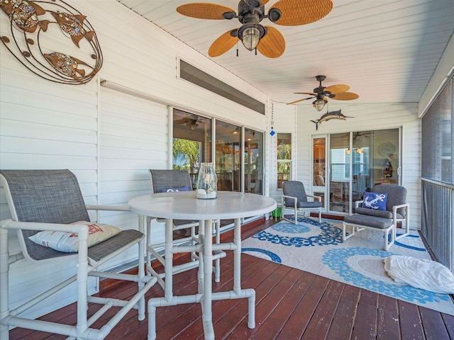 4292 Tahiti Dr, Hernando Beach, FL 34607 - wooden terrace with a ceiling fan and outdoor dining area