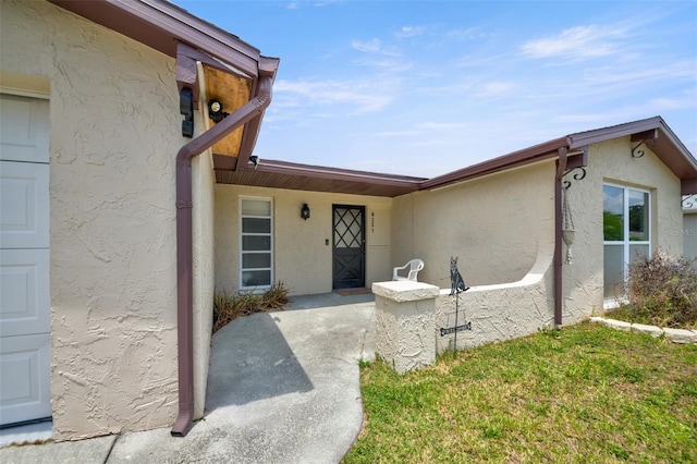 6231 Westport Dr, Port Richey, FL 34668 - entrance to property featuring stucco siding