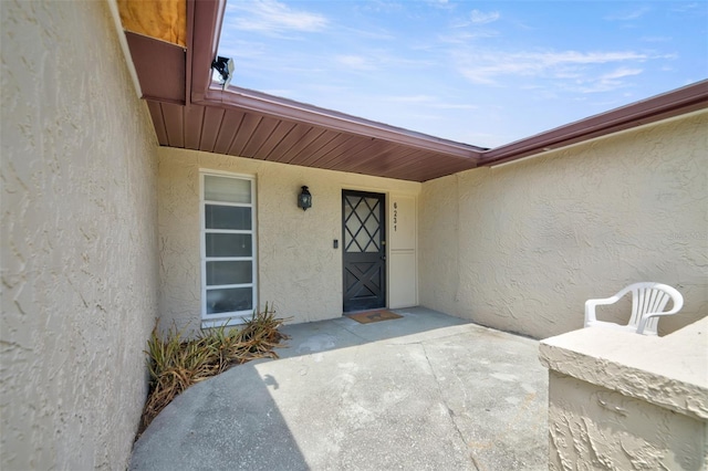 6231 Westport Dr, Port Richey, FL 34668 - entrance to property with stucco siding