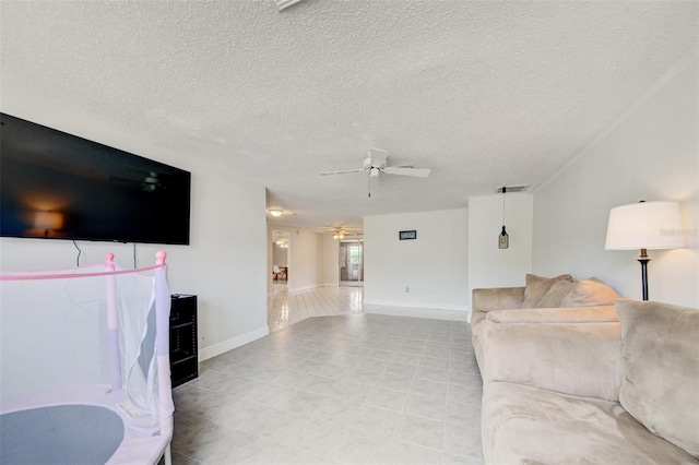 6231 Westport Dr, Port Richey, FL 34668 - living room with ceiling fan, a textured ceiling, and baseboards