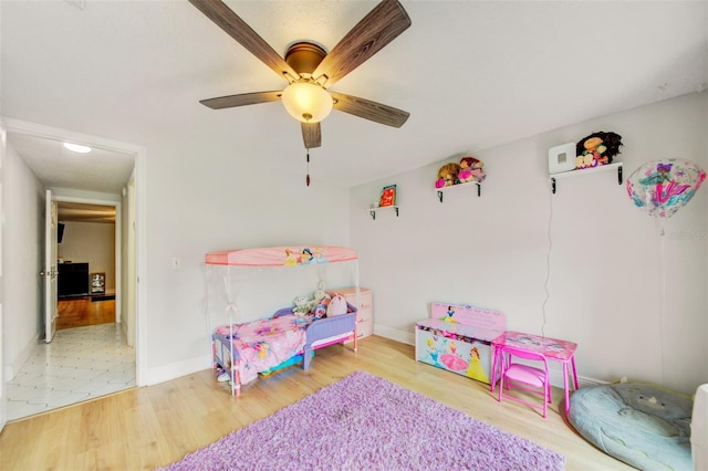 6231 Westport Dr, Port Richey, FL 34668 - game room with a ceiling fan, wood finished floors, and baseboards