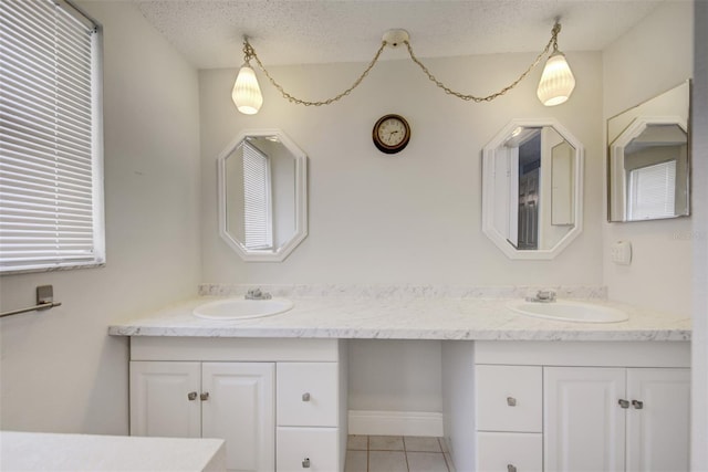 6231 Westport Dr, Port Richey, FL 34668 - full bathroom with double vanity, tile patterned floors, and a textured ceiling