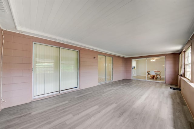 6231 Westport Dr, Port Richey, FL 34668 - unfurnished room featuring wood finished floors and crown molding