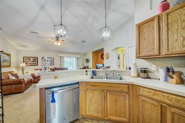 kitchen featuring stainless steel dishwasher, a peninsula, a sink, a chandelier, and lofted ceiling