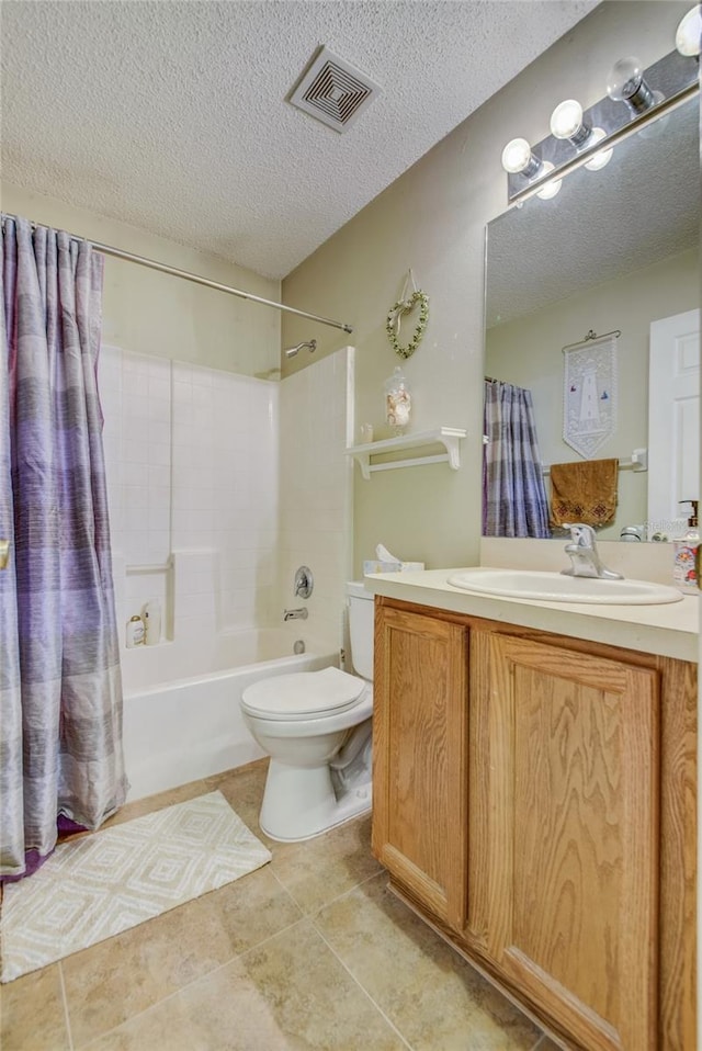 bathroom featuring toilet, vanity, tile patterned floors, a textured ceiling, and shower / bath combo