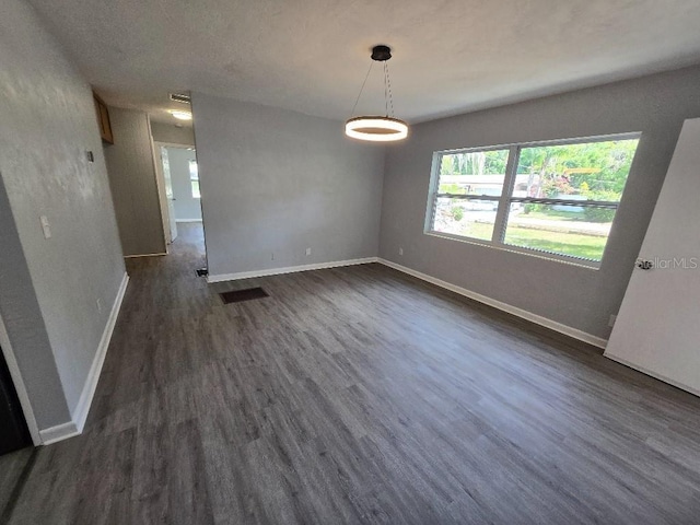 2827 SE 2nd St, Ocala, FL 34471 - unfurnished room with dark wood-style floors and baseboards