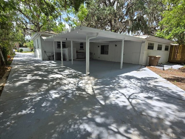 2827 SE 2nd St, Ocala, FL 34471 - view of front of home with a carport, driveway, and fence