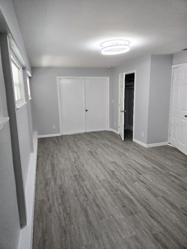 2827 SE 2nd St, Ocala, FL 34471 - unfurnished bedroom with wood finished floors and baseboards