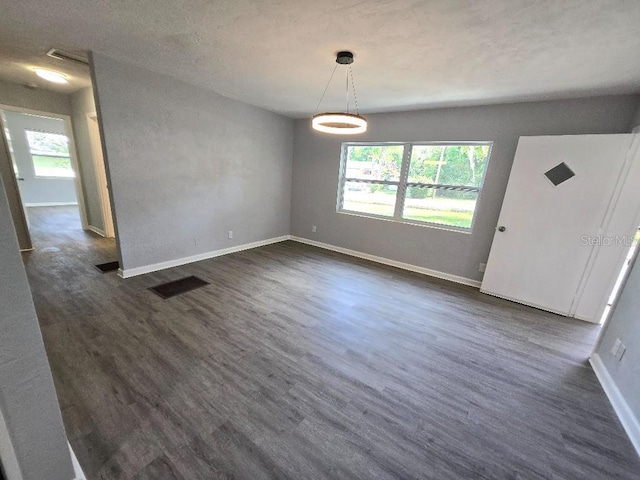 2827 SE 2nd St, Ocala, FL 34471 - unfurnished dining area featuring dark wood-style flooring and baseboards