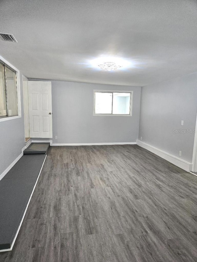 2827 SE 2nd St, Ocala, FL 34471 - empty room with dark wood-type flooring and baseboards