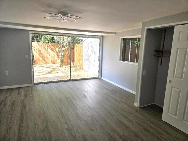 2827 SE 2nd St, Ocala, FL 34471 - empty room featuring baseboards, dark wood-style floors, and a ceiling fan