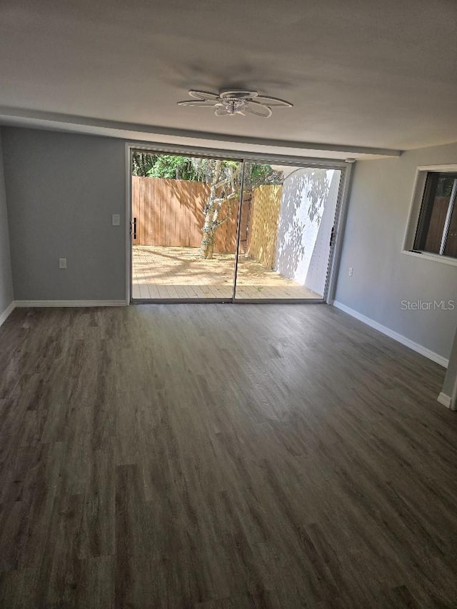 2827 SE 2nd St, Ocala, FL 34471 - spare room featuring wood finished floors, baseboards, and a ceiling fan