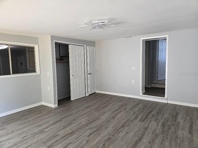 2827 SE 2nd St, Ocala, FL 34471 - unfurnished bedroom featuring wood finished floors, baseboards, and a closet