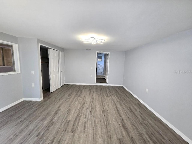 2827 SE 2nd St, Ocala, FL 34471 - unfurnished bedroom featuring wood finished floors, baseboards, and a closet