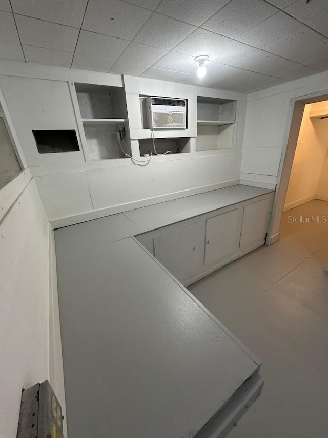 2827 SE 2nd St, Ocala, FL 34471 - kitchen featuring open shelves and a wall unit AC
