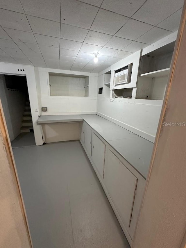 2827 SE 2nd St, Ocala, FL 34471 - bathroom featuring a wall mounted AC, a paneled ceiling, and finished concrete flooring