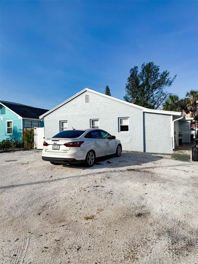 13228 3rd St E, Madeira Beach, FL 33708 - view of home's exterior featuring stucco siding