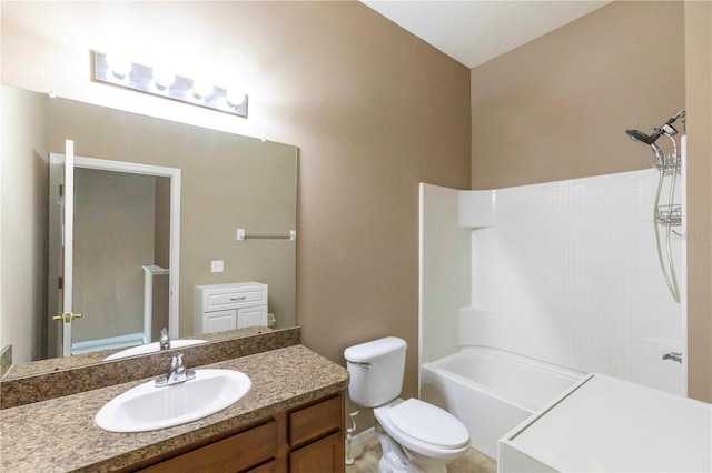 full bath with toilet, vanity, bathtub / shower combination, and baseboards