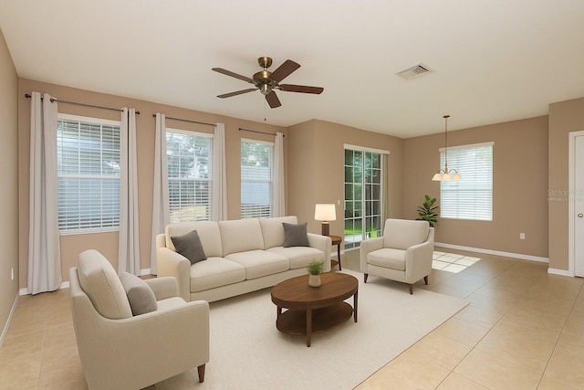 8409 Blue Rock Dr, New Port Richey, FL 34653 - living area featuring baseboards, ceiling fan, and light tile patterned flooring