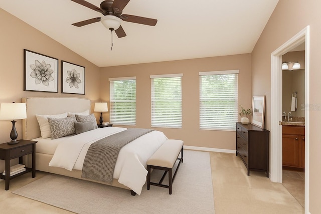 8409 Blue Rock Dr, New Port Richey, FL 34653 - bedroom featuring vaulted ceiling, multiple windows, a sink, ensuite bath, and light colored carpet