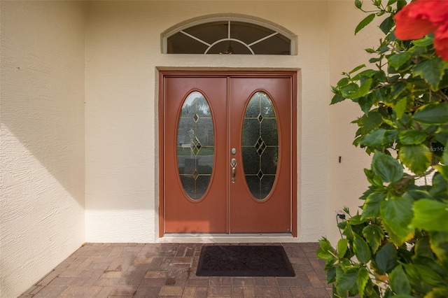 1105 Flora Vista St, New Port Richey, FL 34655 - property entrance featuring stucco siding