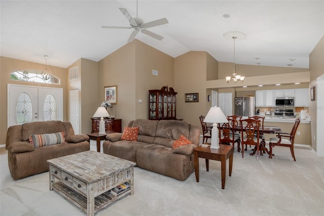1105 Flora Vista St, New Port Richey, FL 34655 - living room with a chandelier, light colored carpet, high vaulted ceiling, a ceiling fan, and baseboards