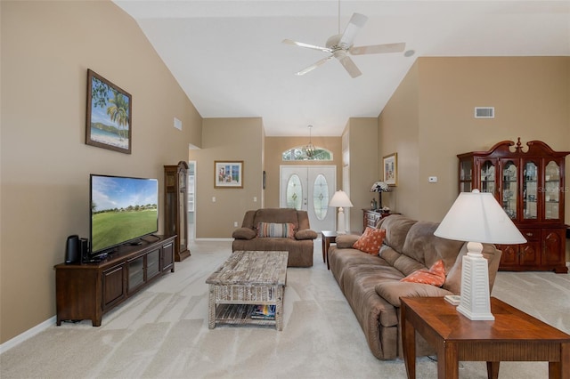 1105 Flora Vista St, New Port Richey, FL 34655 - living room with high vaulted ceiling, light carpet, a ceiling fan, and baseboards