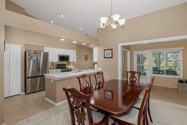 1105 Flora Vista St, New Port Richey, FL 34655 - dining space with light tile patterned floors, a chandelier, recessed lighting, high vaulted ceiling, and light colored carpet