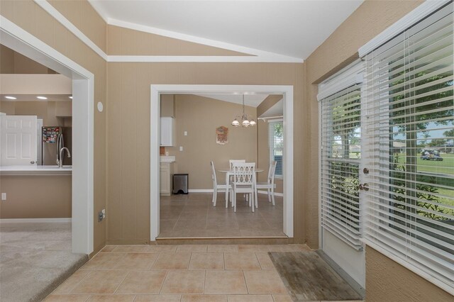1105 Flora Vista St, New Port Richey, FL 34655 - sunroom featuring vaulted ceiling, a chandelier, and a sink
