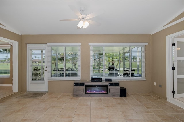1105 Flora Vista St, New Port Richey, FL 34655 - living area featuring lofted ceiling, ceiling fan, and tile patterned flooring