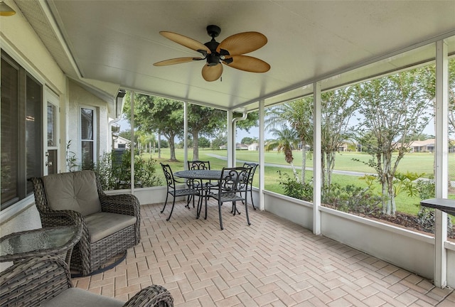 1105 Flora Vista St, New Port Richey, FL 34655 - sunroom with a ceiling fan, golf course view, and healthy amount of natural light