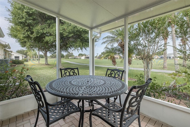 1105 Flora Vista St, New Port Richey, FL 34655 - sunroom with outdoor dining space and golf course view