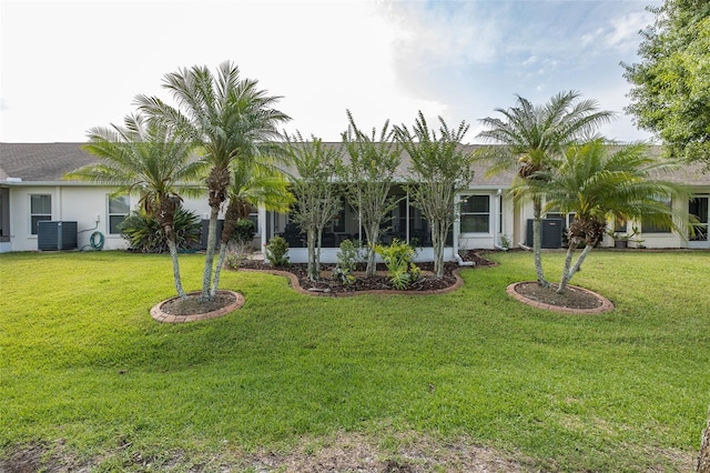 1105 Flora Vista St, New Port Richey, FL 34655 - view of green lawn featuring central air condition unit