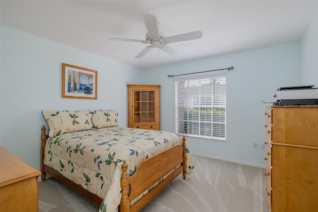 1105 Flora Vista St, New Port Richey, FL 34655 - carpeted bedroom with baseboards and ceiling fan